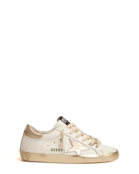 Super-Star sneakers with gold sparkle foxing and metal stud Super-Star sneakers with gold sparkle foxing and metal stud