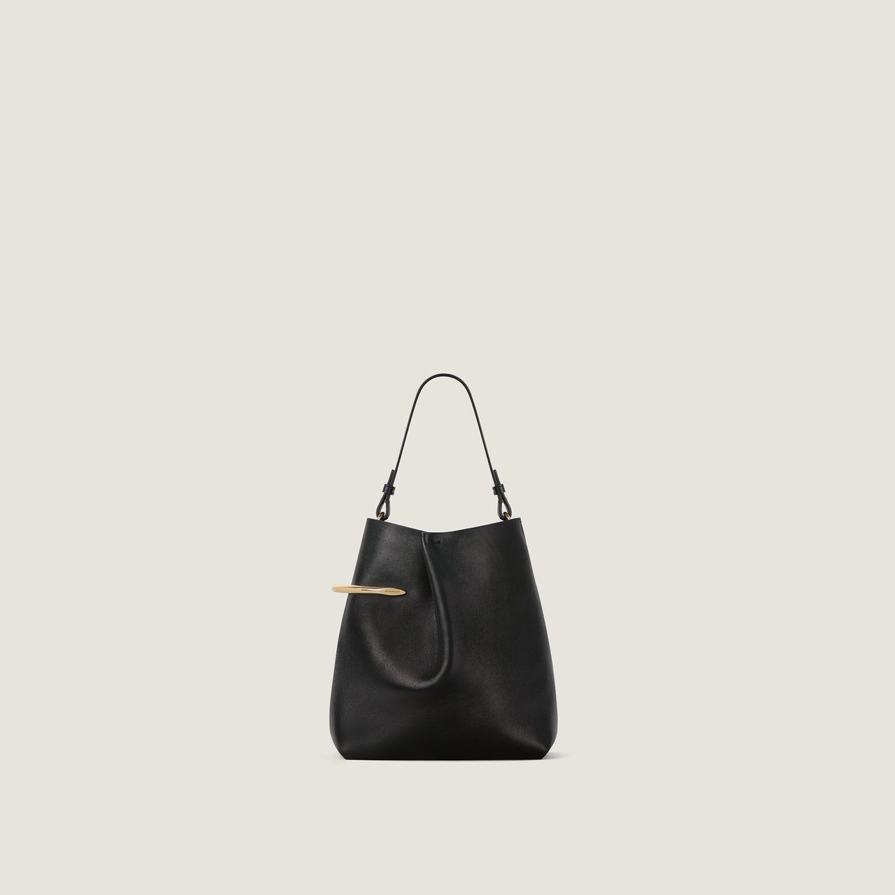 A sleek black leather handbag with a short handle and a gold-tone accent, set against a plain light-colored background.