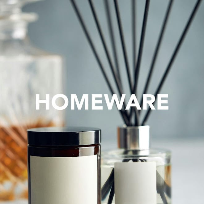 Homeware display with a reed diffuser and a candle jar featuring the text "HOMEWARE" in bold white letters.